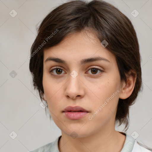 Neutral white young-adult female with medium  brown hair and brown eyes