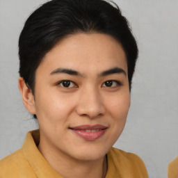 Joyful asian young-adult female with medium  brown hair and brown eyes