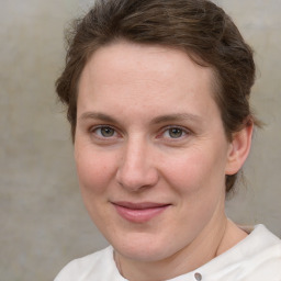 Joyful white adult female with short  brown hair and brown eyes