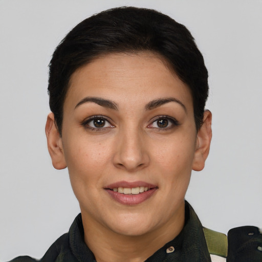Joyful white young-adult female with short  brown hair and brown eyes