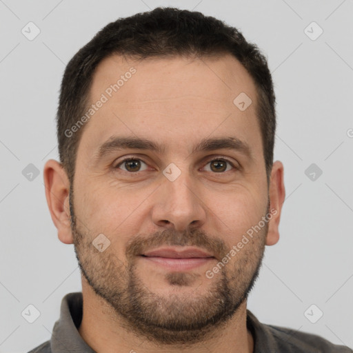 Joyful white adult male with short  brown hair and brown eyes