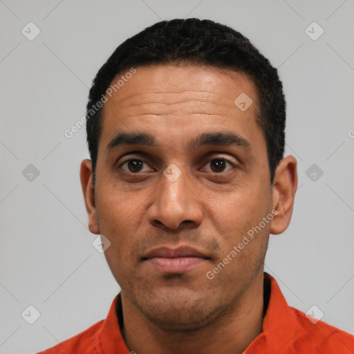 Neutral latino adult male with short  black hair and brown eyes