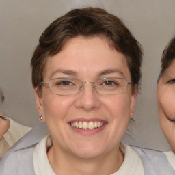 Joyful white adult female with short  brown hair and brown eyes