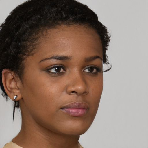 Neutral black young-adult female with short  brown hair and brown eyes