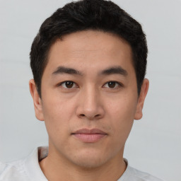 Neutral asian young-adult male with short  brown hair and brown eyes