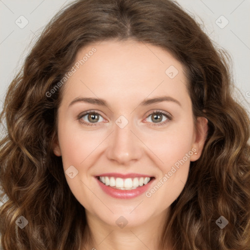 Joyful white young-adult female with long  brown hair and green eyes