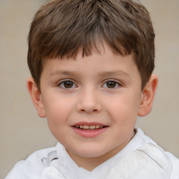 Joyful white child male with short  brown hair and brown eyes