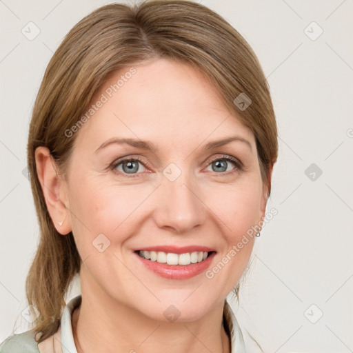 Joyful white young-adult female with medium  brown hair and blue eyes