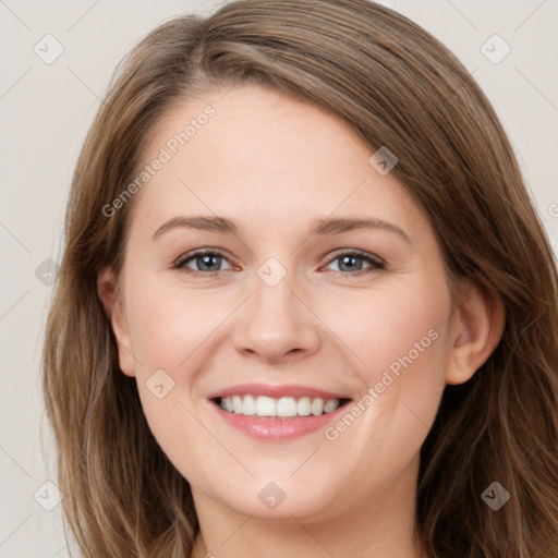 Joyful white young-adult female with long  brown hair and green eyes