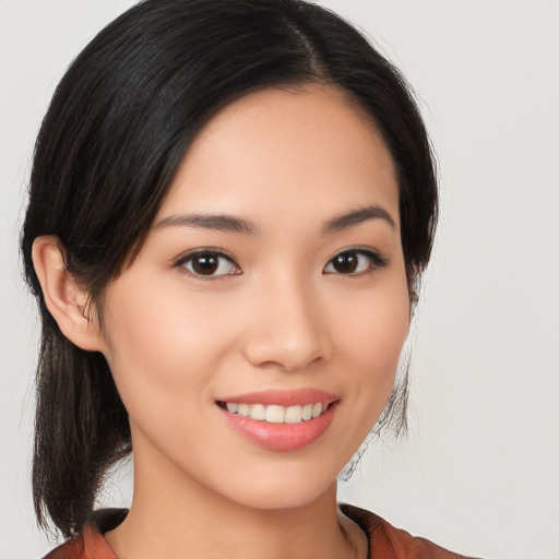 Joyful white young-adult female with medium  black hair and brown eyes