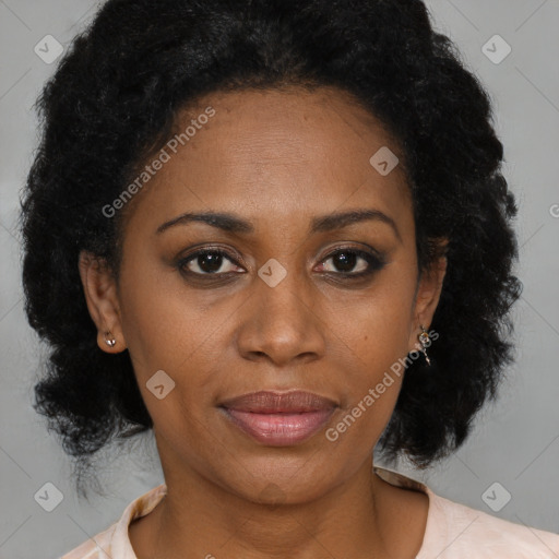 Joyful black adult female with medium  brown hair and brown eyes