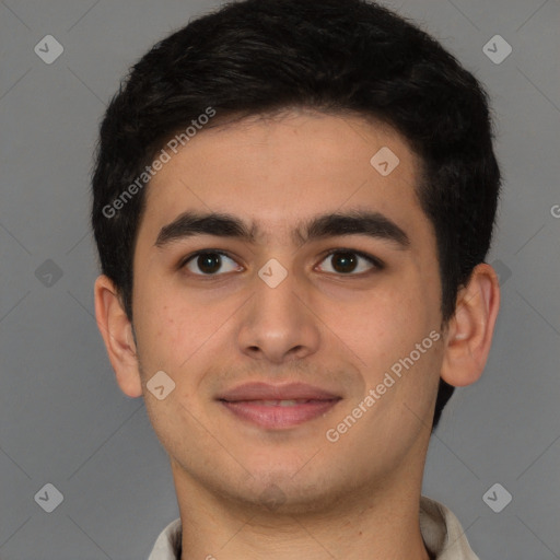 Joyful latino young-adult male with short  brown hair and brown eyes