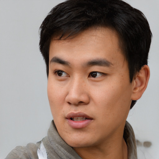 Neutral asian young-adult male with short  black hair and brown eyes