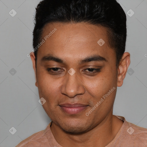 Joyful latino young-adult male with short  black hair and brown eyes