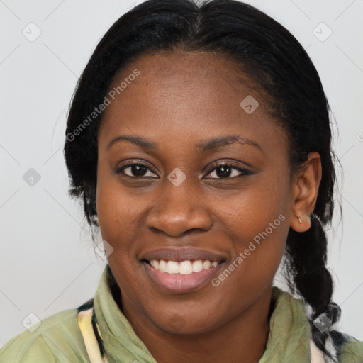 Joyful black young-adult female with medium  brown hair and brown eyes