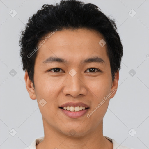 Joyful asian young-adult male with short  black hair and brown eyes