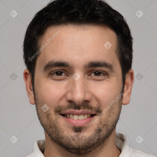 Joyful white young-adult male with short  black hair and brown eyes