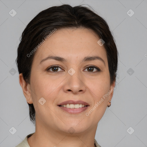 Joyful white adult female with medium  brown hair and brown eyes