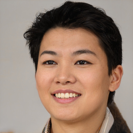 Joyful asian young-adult female with short  brown hair and brown eyes