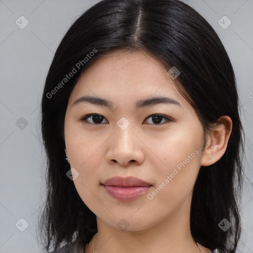 Joyful asian young-adult female with medium  black hair and brown eyes