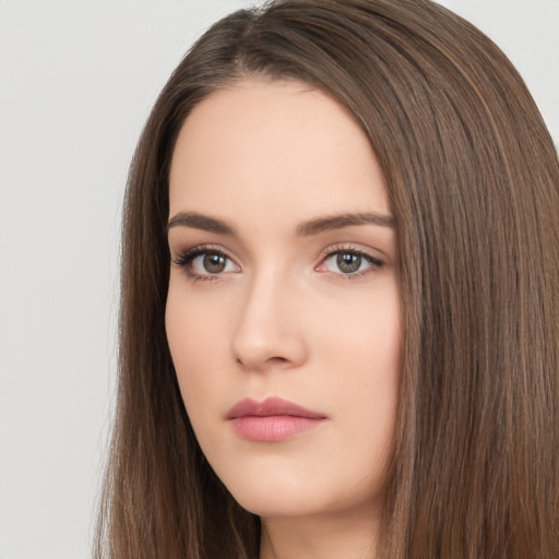 Neutral white young-adult female with long  brown hair and brown eyes