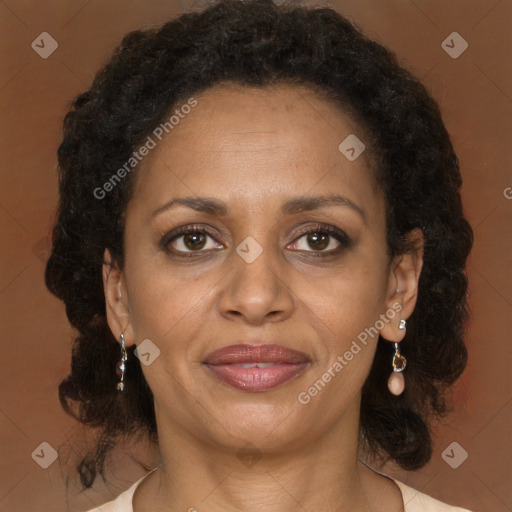 Joyful black adult female with medium  brown hair and brown eyes