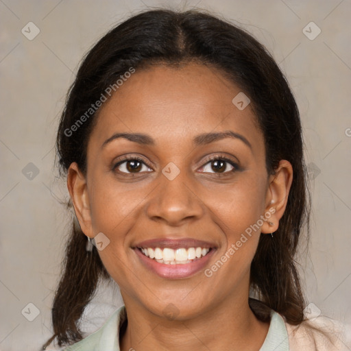 Joyful black young-adult female with medium  brown hair and brown eyes