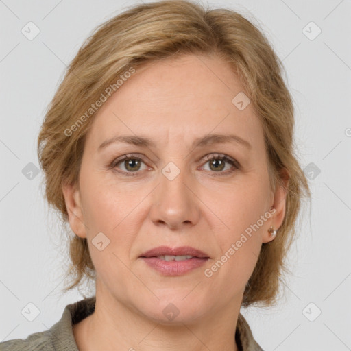 Joyful white adult female with medium  brown hair and grey eyes