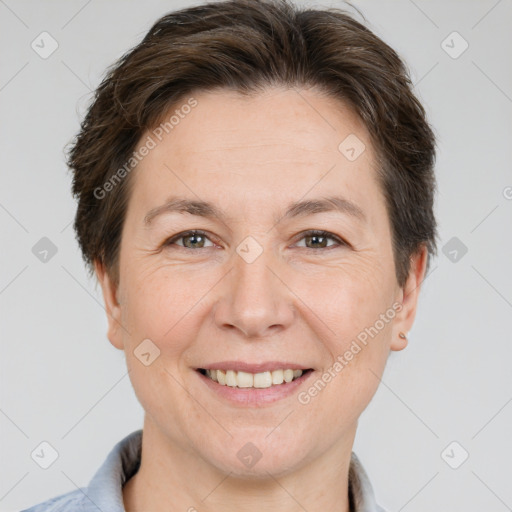 Joyful white adult female with short  brown hair and brown eyes