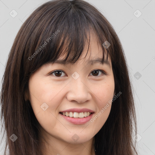 Joyful white young-adult female with long  brown hair and brown eyes