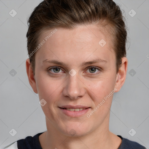 Joyful white young-adult female with short  brown hair and grey eyes