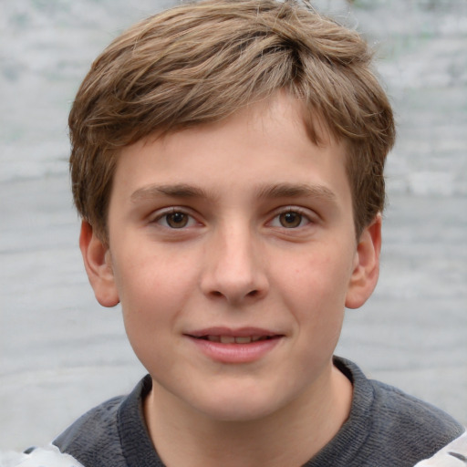 Joyful white child male with short  brown hair and grey eyes