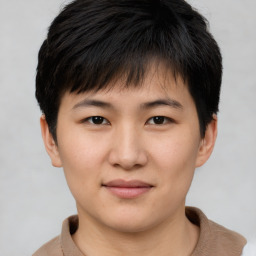 Joyful asian young-adult female with short  brown hair and brown eyes