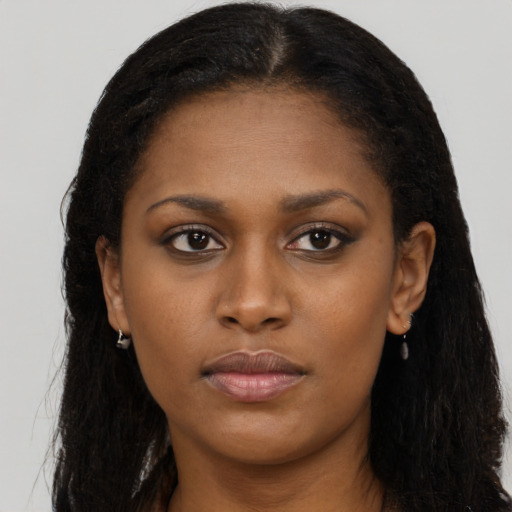 Neutral black young-adult female with long  brown hair and brown eyes