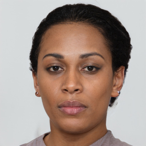 Neutral latino adult female with short  black hair and brown eyes
