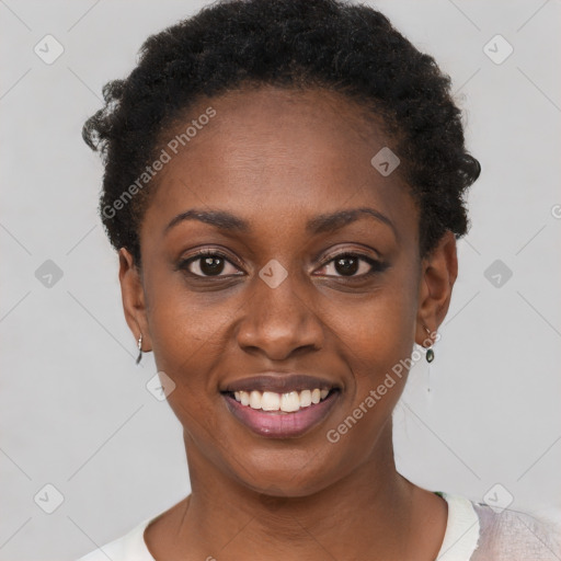 Joyful black young-adult female with short  black hair and brown eyes