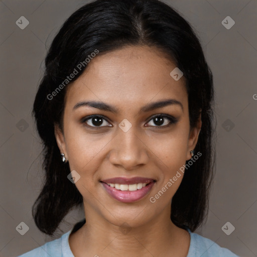 Joyful black young-adult female with medium  black hair and brown eyes