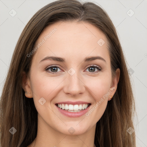 Joyful white young-adult female with long  brown hair and grey eyes