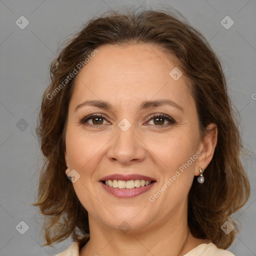 Joyful white adult female with medium  brown hair and brown eyes