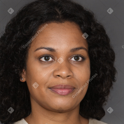 Joyful black young-adult female with long  brown hair and brown eyes