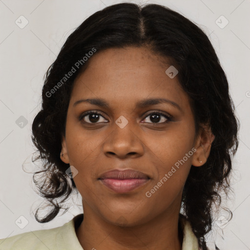 Joyful black young-adult female with medium  brown hair and brown eyes