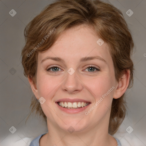 Joyful white young-adult female with medium  brown hair and blue eyes