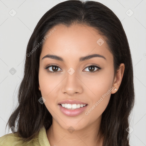 Joyful latino young-adult female with long  brown hair and brown eyes