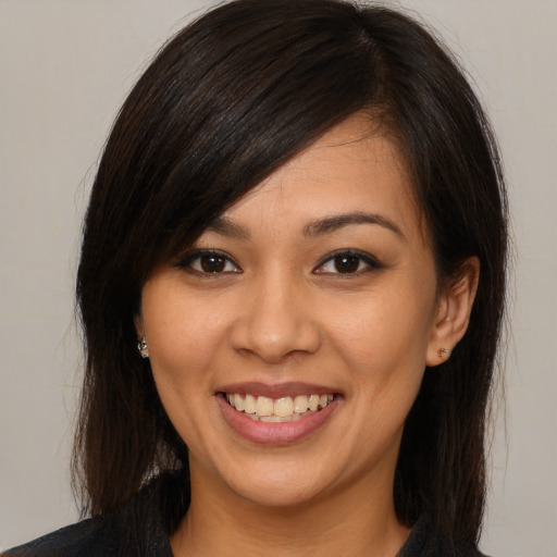 Joyful white young-adult female with medium  brown hair and brown eyes