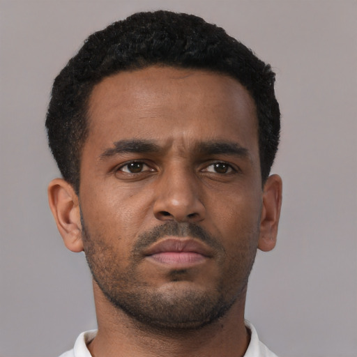 Neutral black young-adult male with short  brown hair and brown eyes