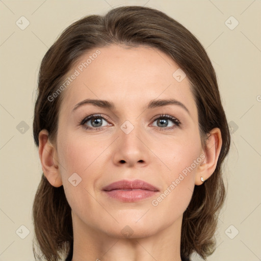 Joyful white young-adult female with medium  brown hair and green eyes