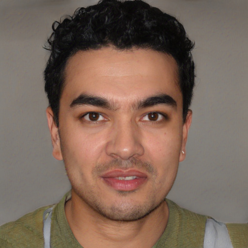 Joyful latino young-adult male with short  brown hair and brown eyes