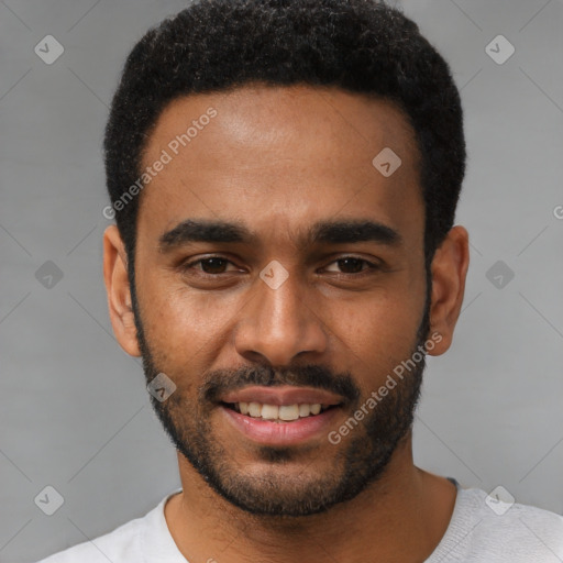 Joyful black young-adult male with short  black hair and brown eyes