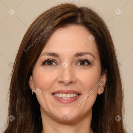 Joyful white adult female with long  brown hair and brown eyes