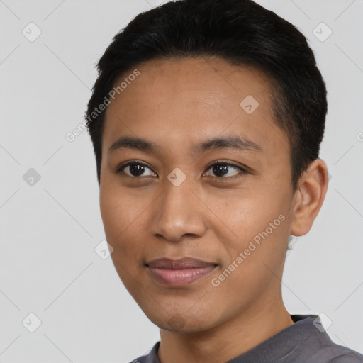 Joyful asian young-adult male with short  black hair and brown eyes